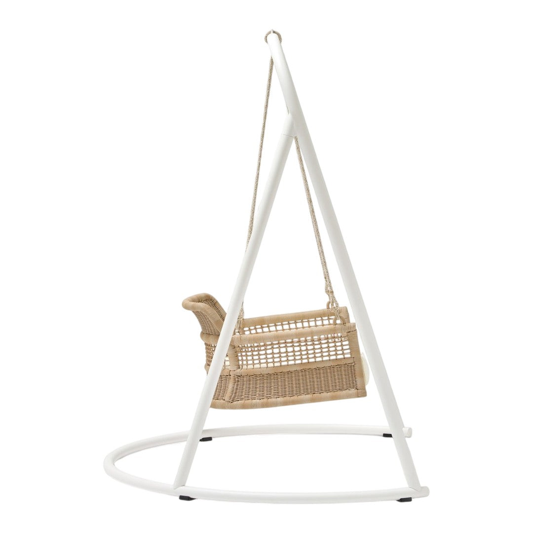 Natural rattan swing chair with a sleek white frame, perfect for modern decor. Minimalist design with neutral tones.