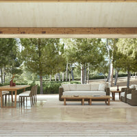 Modern outdoor living space with neutral beige and earthy brown tones, complemented by natural wood accents.