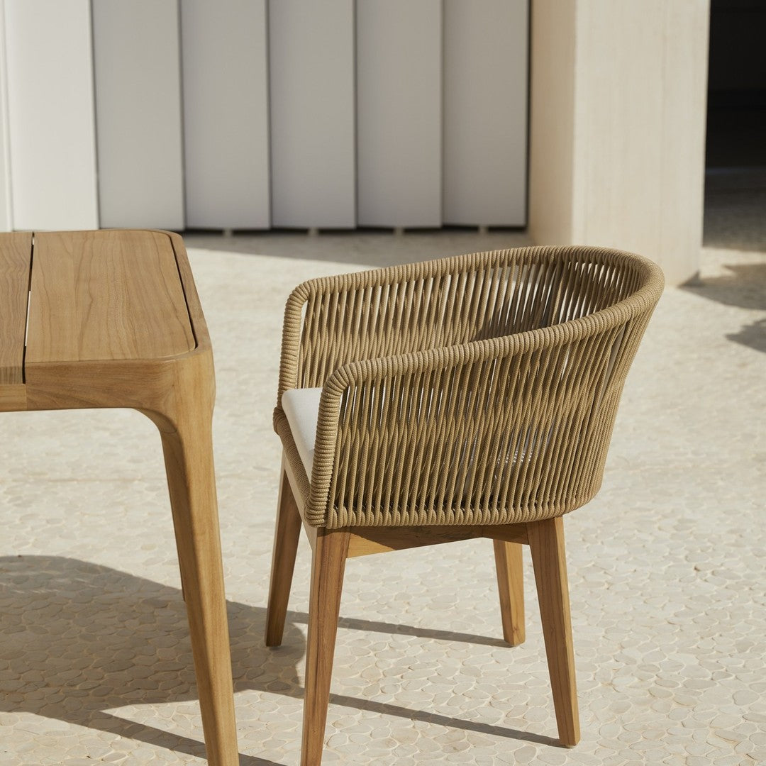 "Cozy rattan chair with natural woven pattern and light wood legs, perfect for outdoor or modern decor."