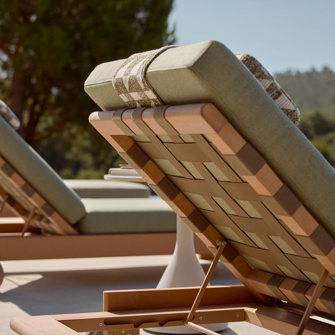 Green and tan striped lounge chair with a woven wood pattern, perfect for outdoor relaxation.