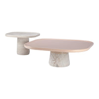 Modern coffee tables in soft pink and marble with smooth, curved edges and textured bases. Ideal for contemporary decor.