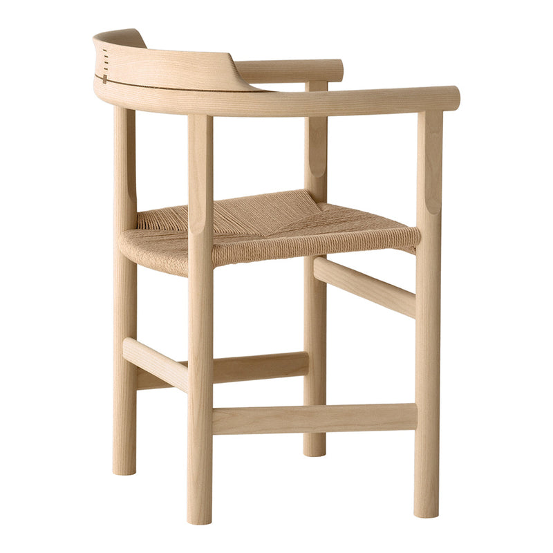 Natural wood finish with a woven seat, featuring minimalist lines and a soft, neutral color palette.