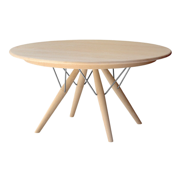 Round wooden table with a natural light finish and sleek metallic wire base, featuring a minimalist design.