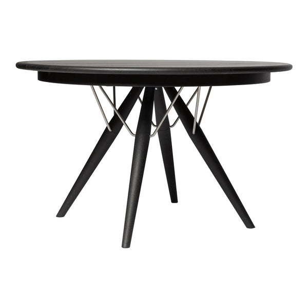 Modern round table with a sleek black top, featuring a unique geometric base and minimalist design. Perfect for any decor.