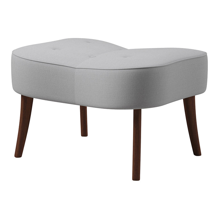 Light gray upholstered ottoman with a curved shape and brown wooden legs, featuring a smooth, tufted surface.