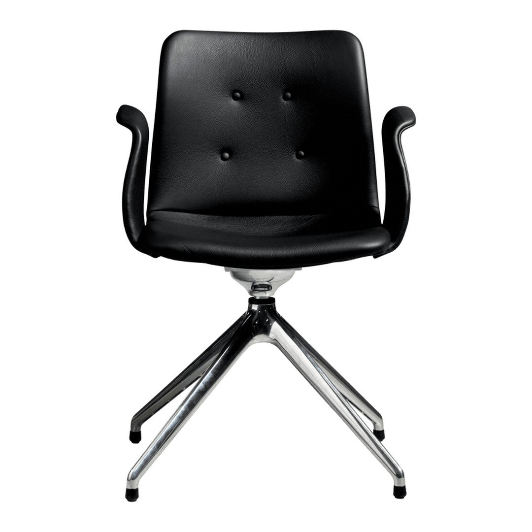 Black leather office chair with button tufting and chrome base, featuring a sleek, modern design.