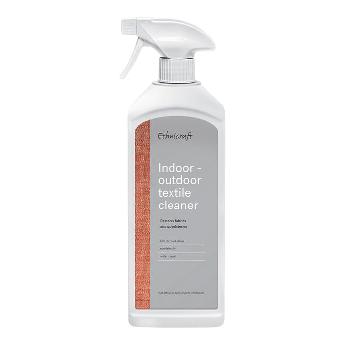 White spray bottle featuring a subtle grey label with orange accent. Simple and clean design for textile cleaner.