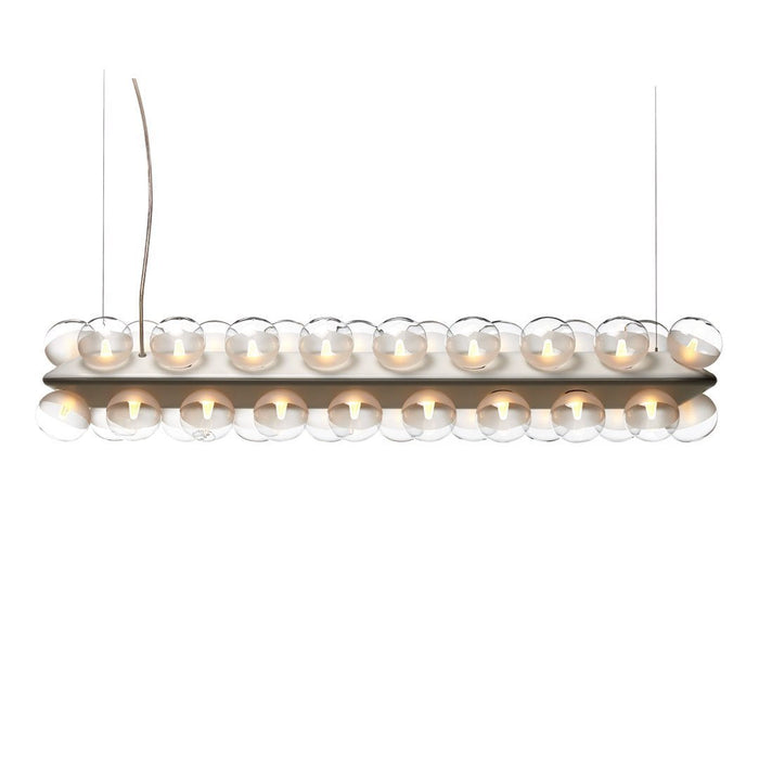 Clear glass orbs on a wooden base, creating a sleek, modern design with neutral tones and a minimalist look.
