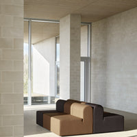 "Modern sectional sofa in warm brown and dark chocolate colors, featuring smooth, minimalist patterns."