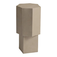 Beige octagonal pedestal table with minimalist geometric design, showcasing smooth, matte finish.