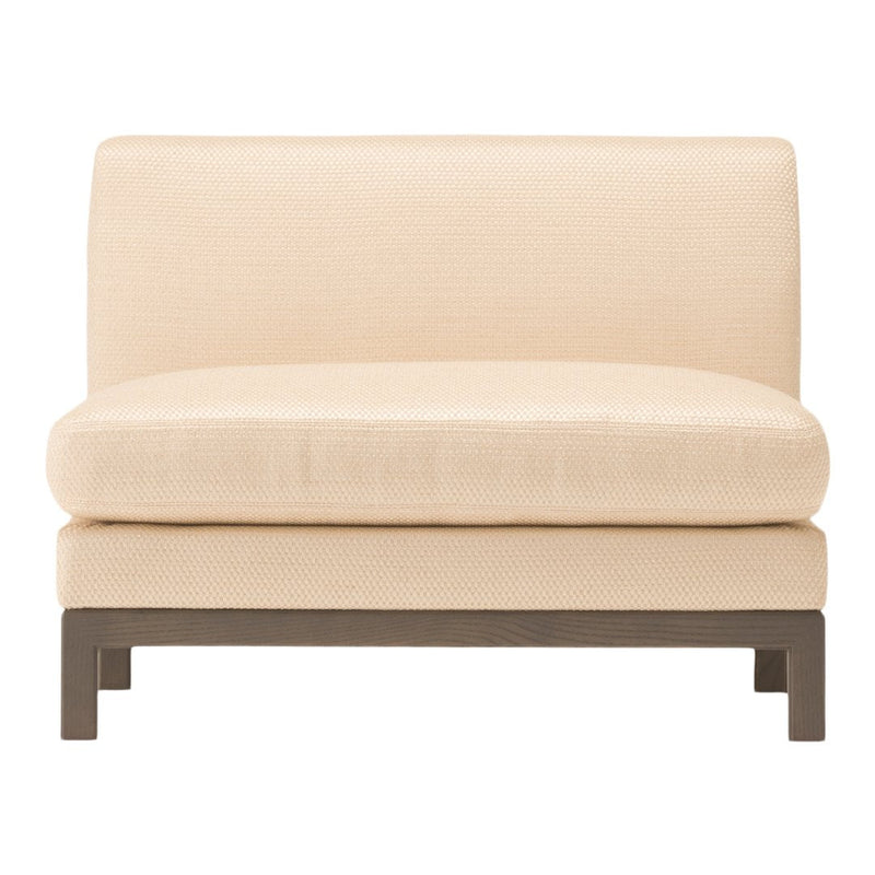 Cream-colored upholstered chair with a sleek, modern design and dark wood legs. Ideal for contemporary interiors.