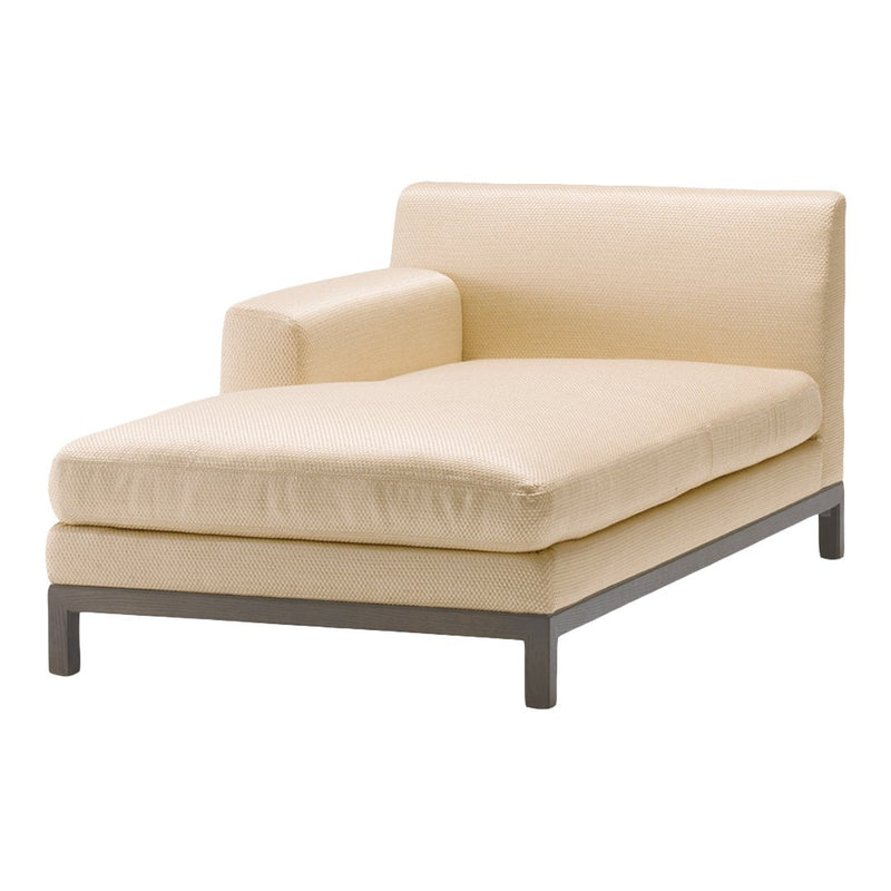 Beige modern chaise lounge with a minimalist design and smooth texture, featuring a sleek metal base. Perfect for any decor.
