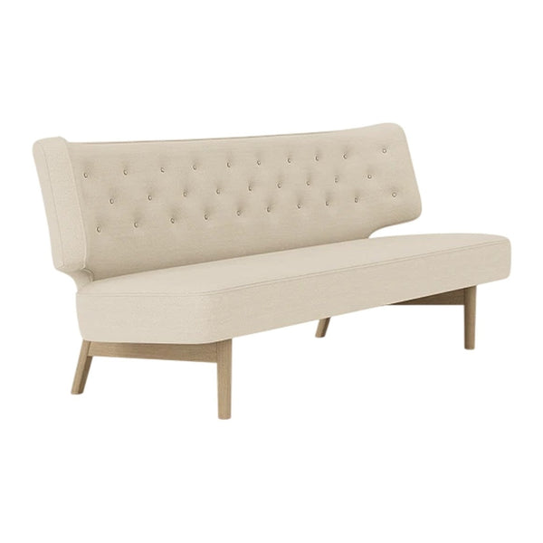 Beige upholstered sofa with tufted detailing and light wood legs, featuring a smooth, simple design.