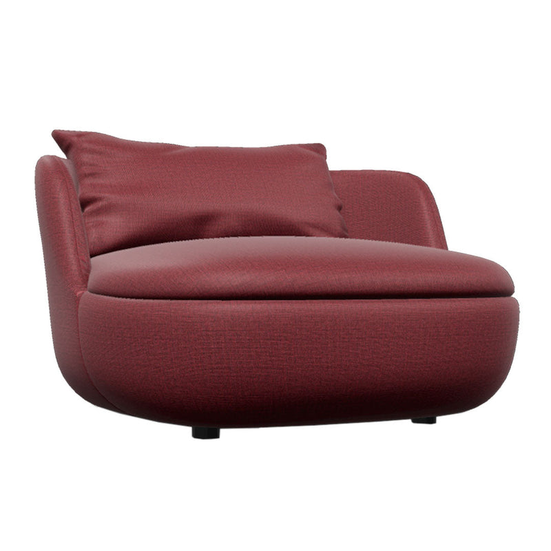 Burgundy faux leather chair with smooth surface and a plush accent pillow, featuring a modern, rounded design.