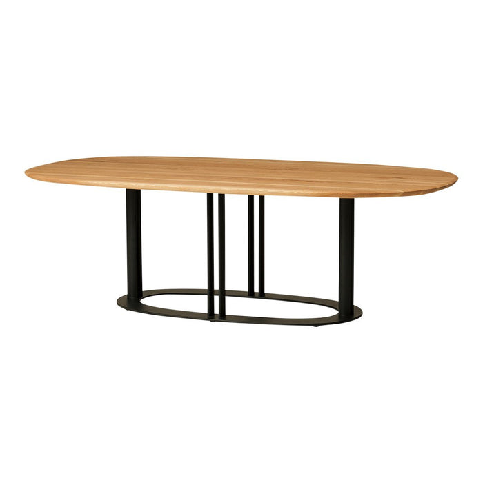 Oval wooden dining table with a natural wood finish and black metal base, featuring a sleek and modern design.