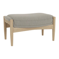 Light gray upholstered ottoman with a smooth, rounded cushion and natural wood legs. Modern, minimalist design.