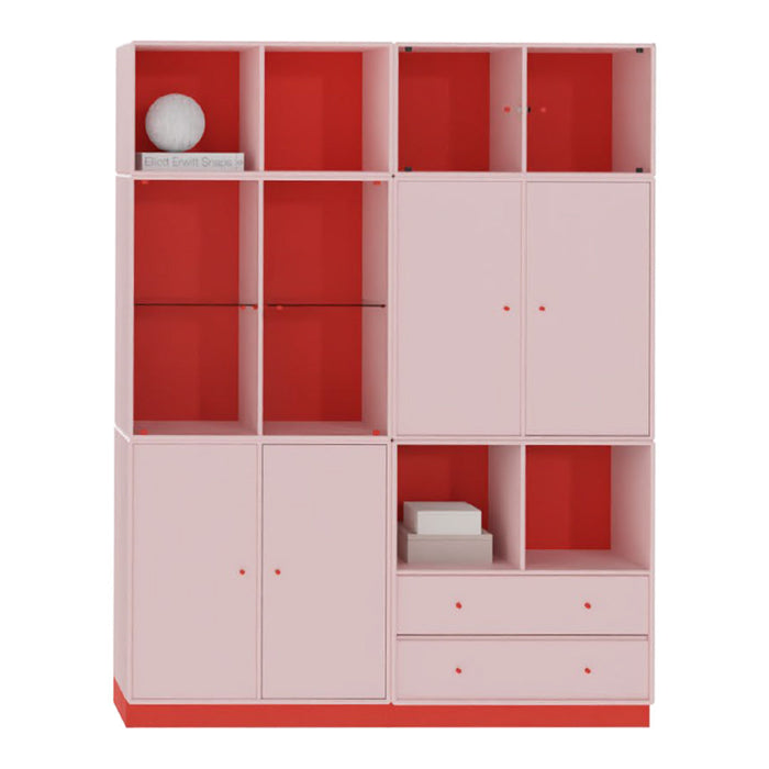 Pink and red storage cabinet featuring geometric patterns and various compartments for organization.