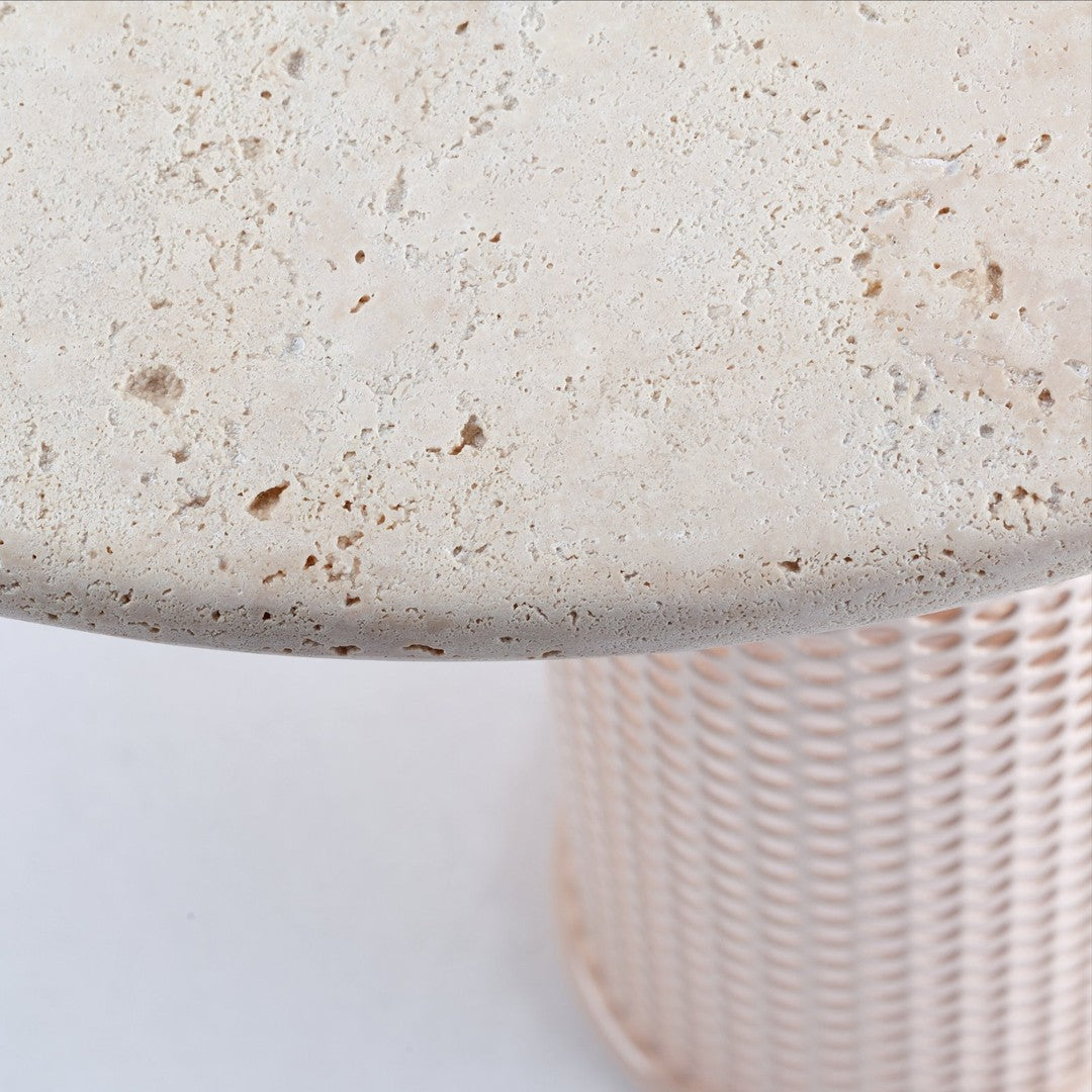 Light beige textured tabletop with a pink woven base, showcasing a modern and stylish design.