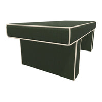 Dark green upholstered coffee table with light beige piping accents. Modern, sleek design perfect for any living space.