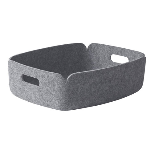 Gray felt storage basket with a minimalist design and subtle texture. Perfect for organizing any space.