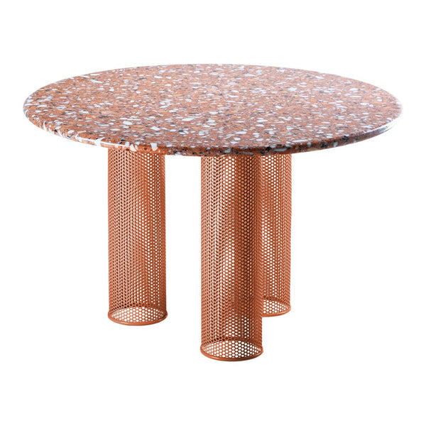 Round table with a speckled orange top and copper mesh legs, offering a modern and stylish design.