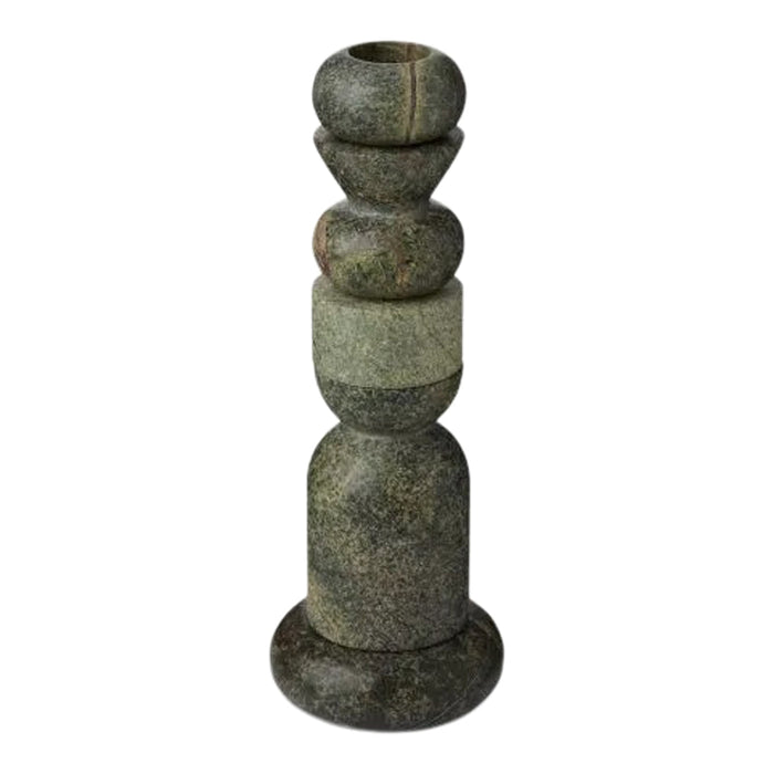 Green and textured stone candle holder with unique geometric patterns and varying shapes.