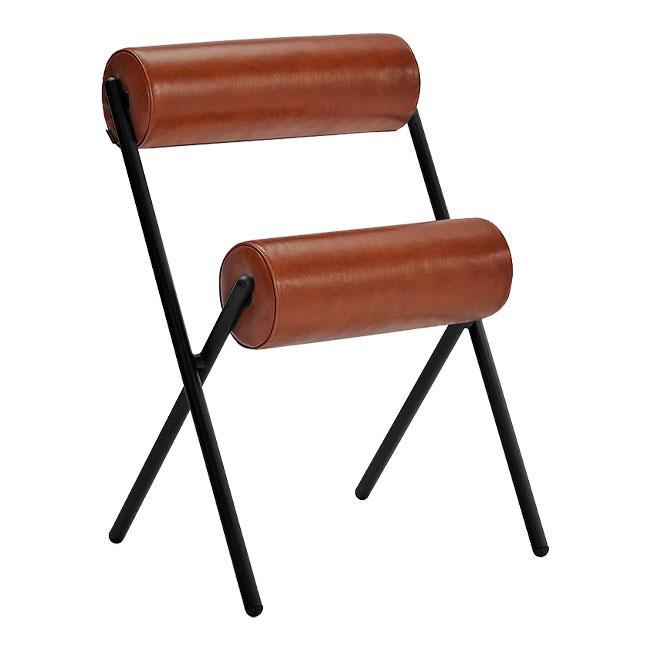 "Stylish brown leather chair with cylindrical cushions and sleek black metal frame, perfect for modern decor."