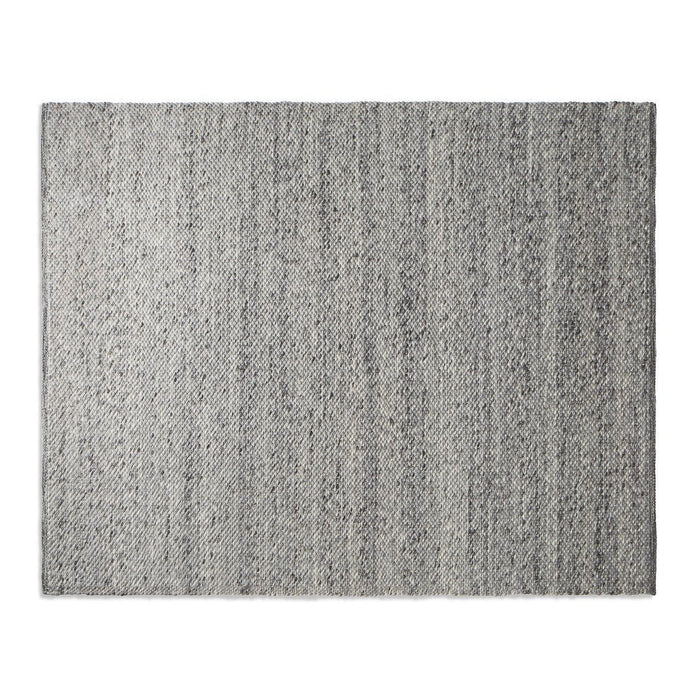 Gray area rug with a subtle linear pattern, featuring varying shades for a textured, modern look.