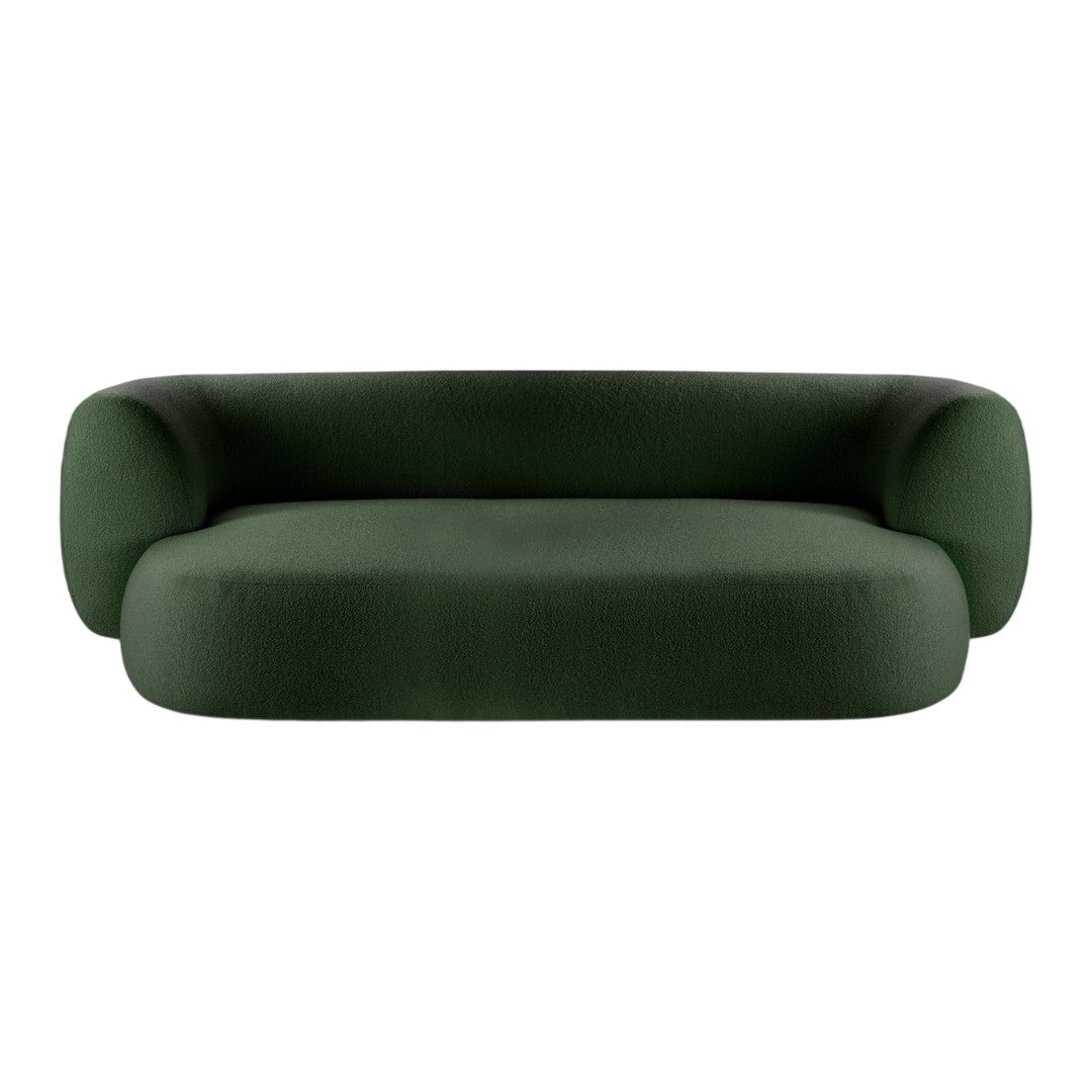 Green velvet sofa with a modern, minimalist design and soft, rounded shapes. Perfect for contemporary interiors.