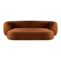 Rust-colored sofa with a sleek, modern design and smooth, rounded edges. Perfect for contemporary interiors.