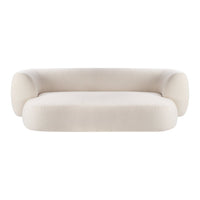 Curved cream-colored sofa with a smooth, minimalist design and plush upholstery, perfect for modern interiors.