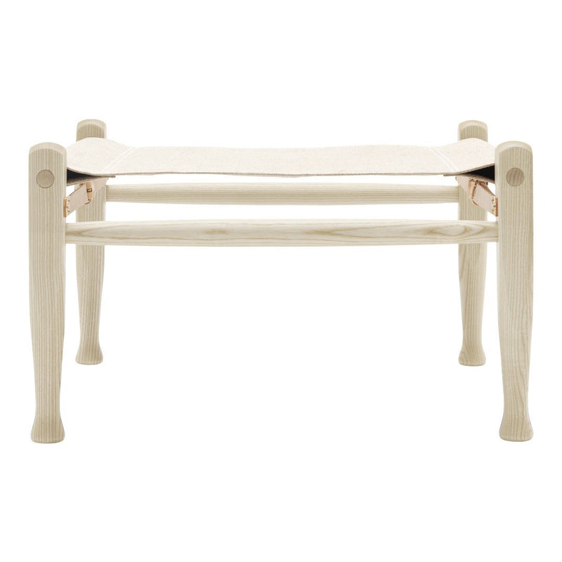 Light wooden bench with a smooth, cream-colored fabric seat, featuring a minimalist design and elegant finish.