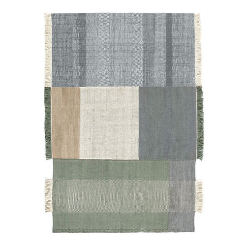 Multicolored area rug featuring gray, green, beige, and cream blocks with textured stripes and fringed edges.