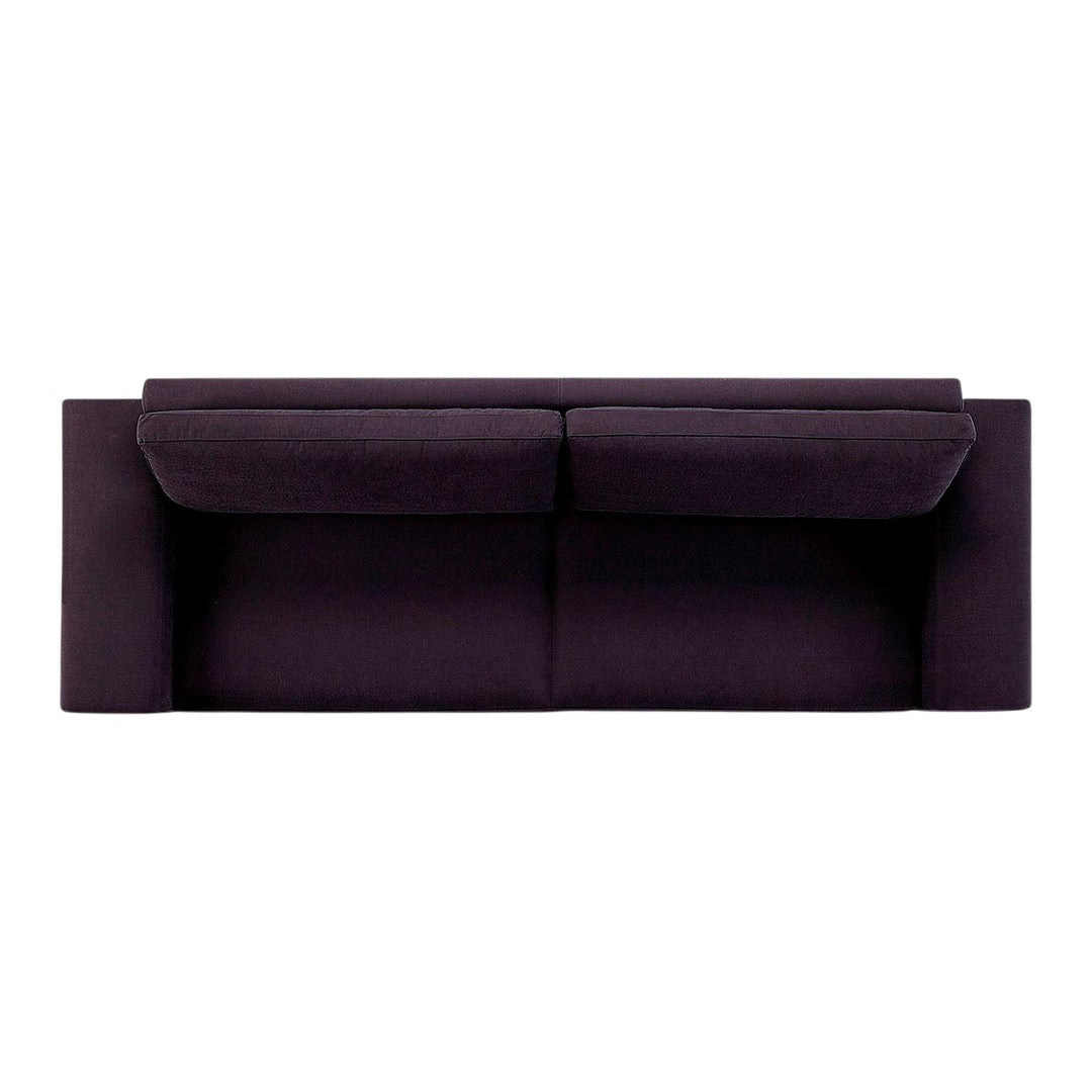 "Dark purple fabric sofa with smooth, modern design and relaxed cushions, ideal for contemporary living spaces."