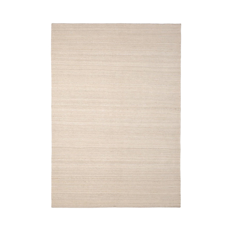 Neutral beige area rug with subtle woven texture and light, understated pattern. Perfect for enhancing any decor.
