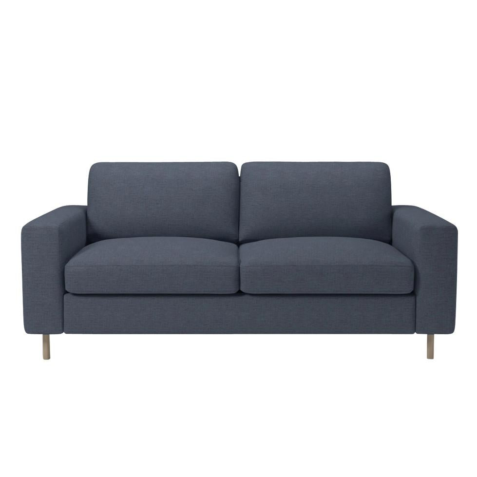 Modern navy blue sofa with a smooth fabric finish and minimalist design. Perfect for contemporary living spaces.