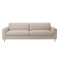 Soft beige upholstered sofa with sleek, modern lines and subtle texture, perfect for any contemporary living space.