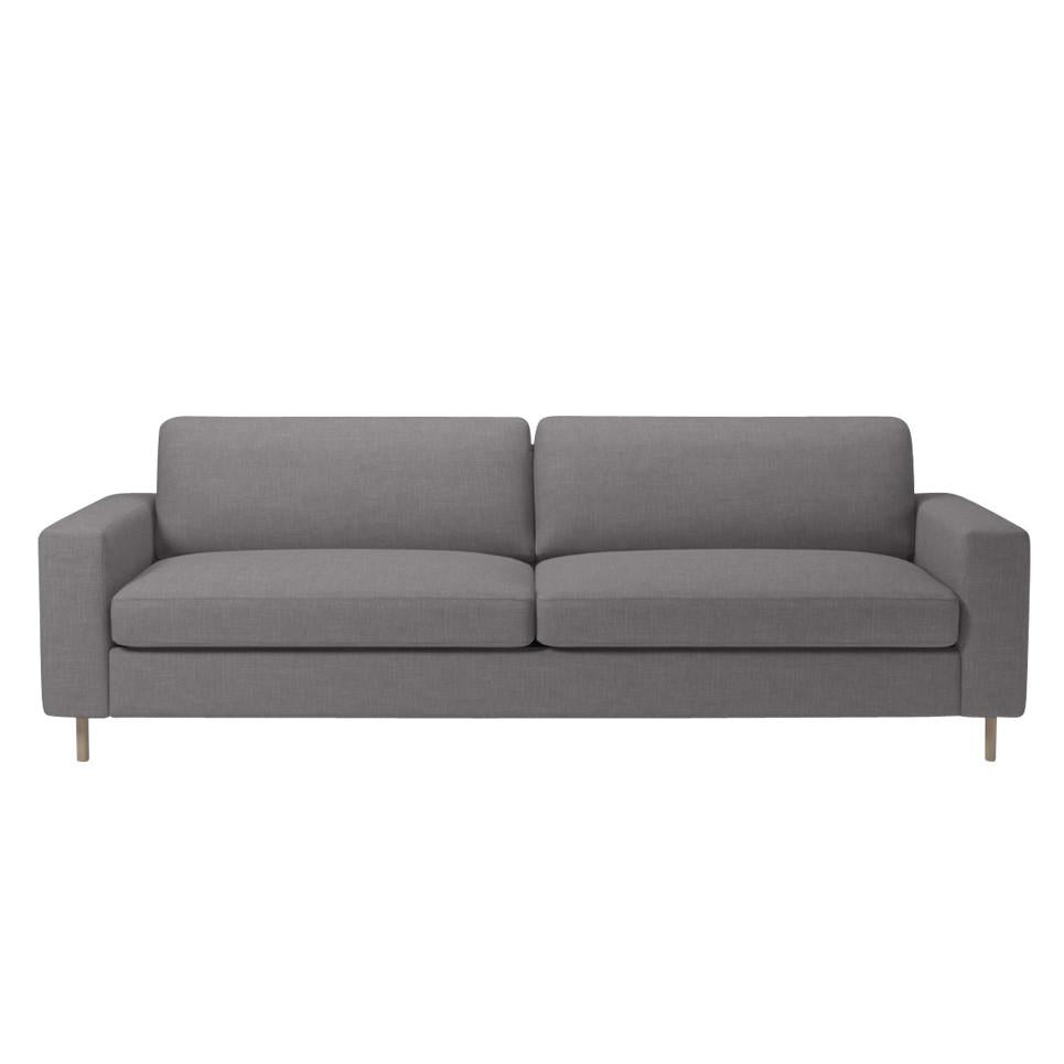 Stylish gray sofa with clean lines, featuring a minimalist design and soft upholstery for a modern aesthetic.