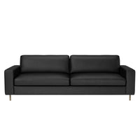 Modern black leather sofa with a sleek, minimalist design and subtle stitching details, perfect for any living space.