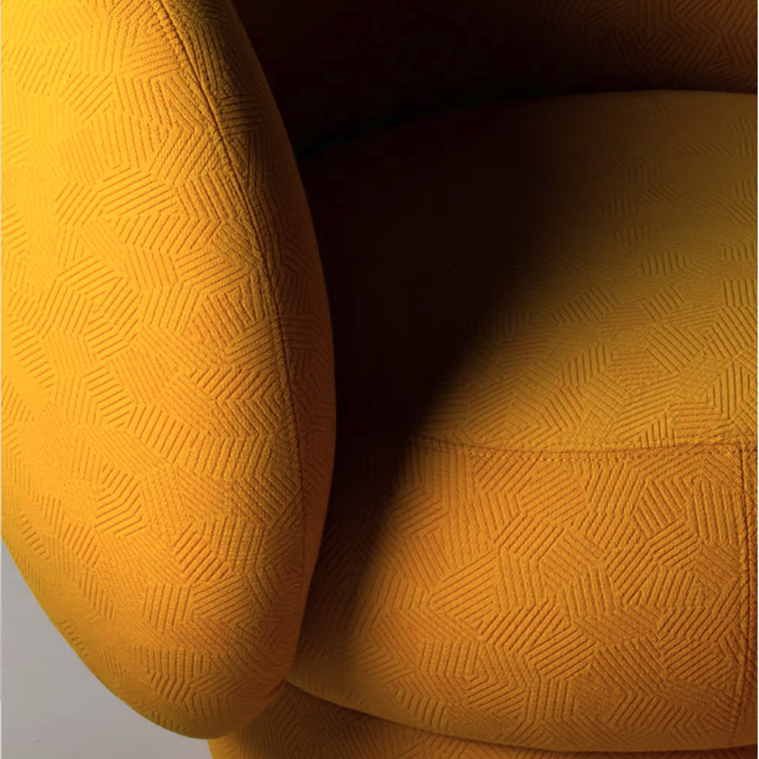 Vibrant yellow armchair featuring a subtle geometric pattern for a stylish modern accent.