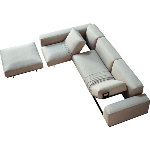 Light beige sectional sofa with smooth fabric and subtle stitching detail, featuring clean lines and modern design.