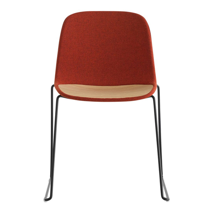 Rust-colored chair with a smooth wood accent and sleek black metal legs for a modern, minimalist look.