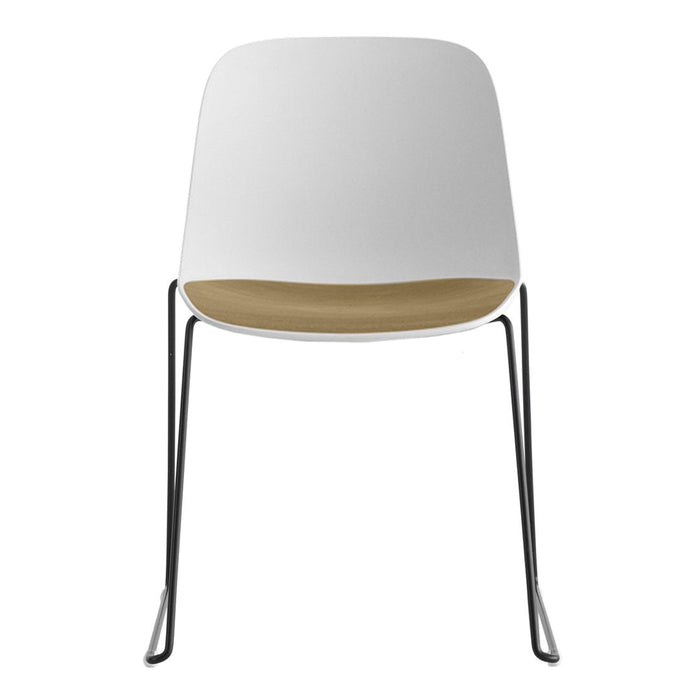 Minimalist white chair with a sleek chrome frame and natural wood accents. Perfect for modern decor.