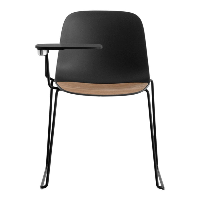 Modern black chair with a wood seat and sleek metal legs, featuring a minimalist design and smooth, curved lines.