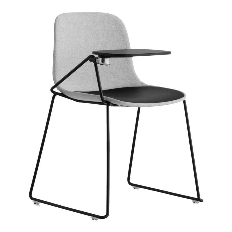 Gray upholstered chair with a sleek black seat and black metal frame, featuring a minimalist design and side table.