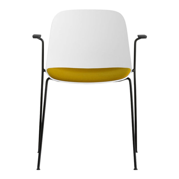 Modern chair featuring a white exterior and vibrant yellow interior, complemented by sleek black legs.