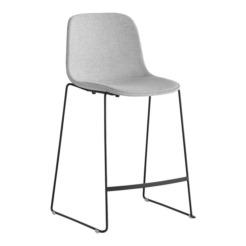 Stylish gray upholstered bar stool with minimalist black metal legs, featuring a sleek, modern design.