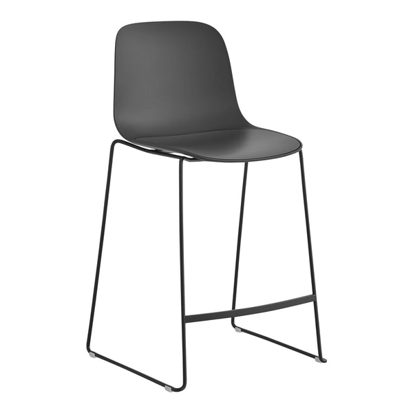 Stylish black bar stool with a smooth seat and sleek metal legs, perfect for modern decor.