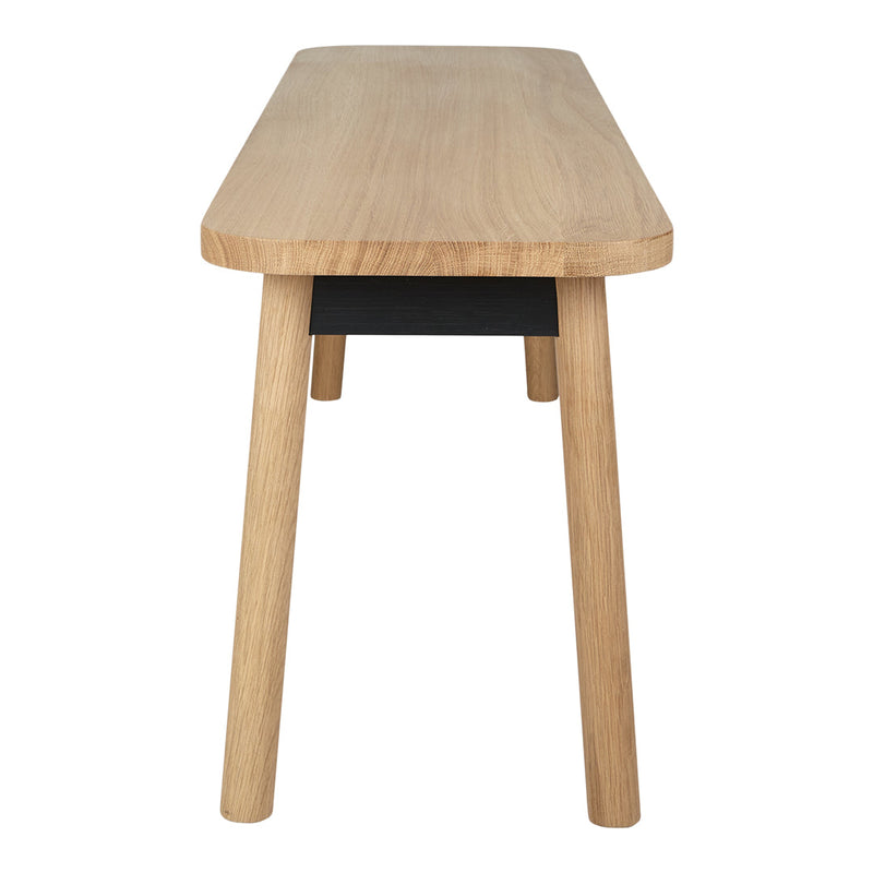 Light oak wood table with a smooth finish and black accent drawer, featuring clean lines and minimalist design.