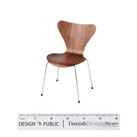 Elegant walnut chair with a smooth finish and sleek metal legs, showcasing a modern, minimalist design.